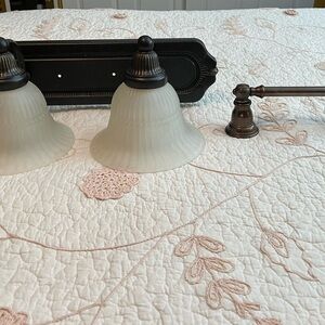 Elegant Two-Light Bathroom Light Fixture with Frosted Glass Shades.